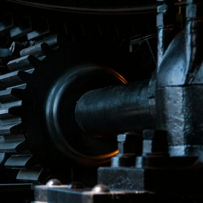 close-up photography of black metal gears